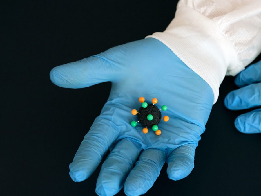 Coronavirus in gloved hand